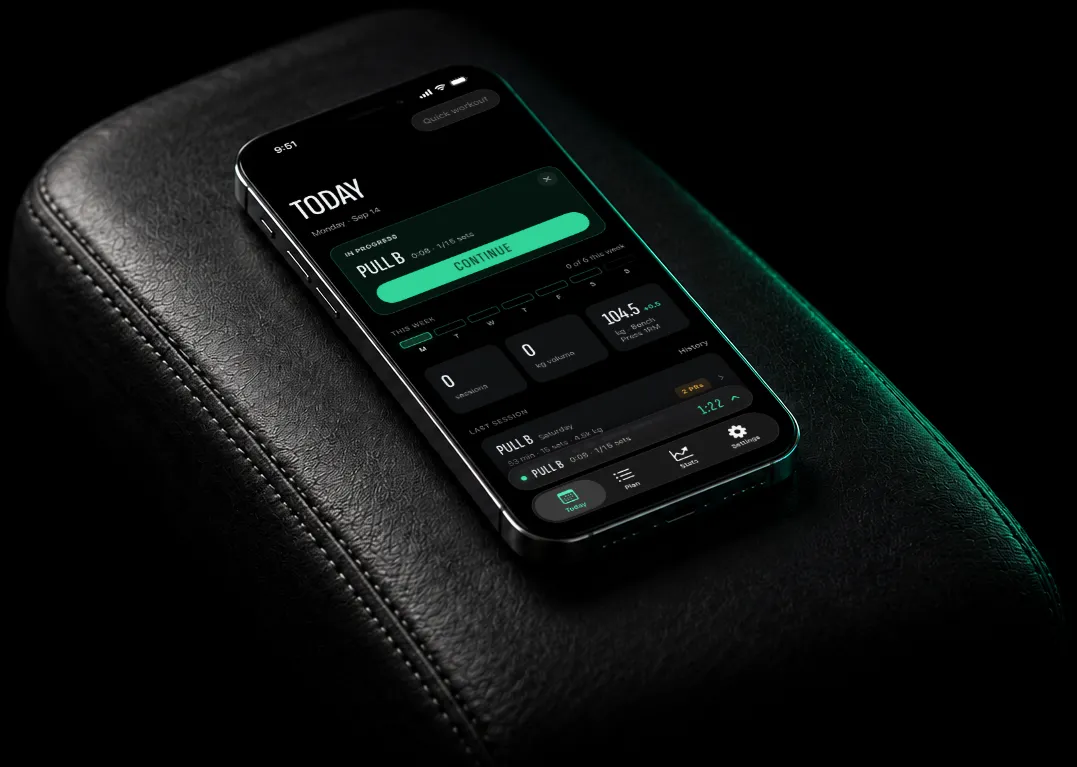 An iPhone on a gym bench showing Volu(me) with a rest timer running